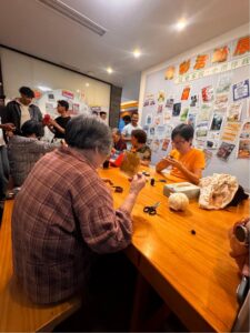 Students from ZUST join elderly residents at the Happiness Neighborhood Workshop for a traditional handcraft session.